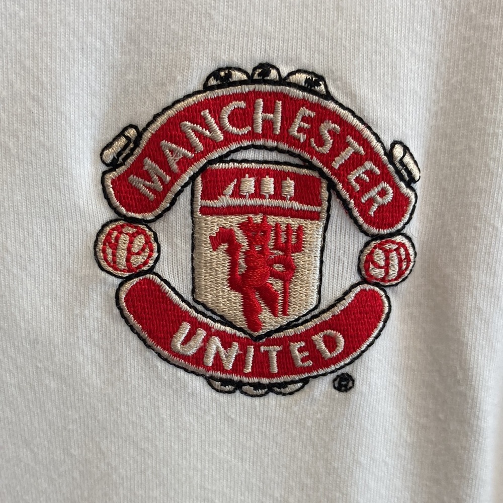 Manchester United white Nike golf shirt.